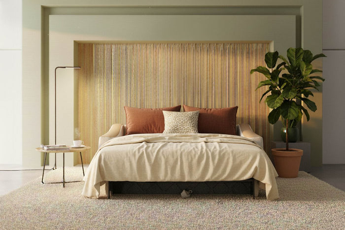 Strike sofa bed opened as a bed in a calm bedroom