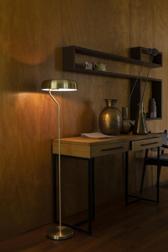 Eclipse brass floor lamp in a warm interior