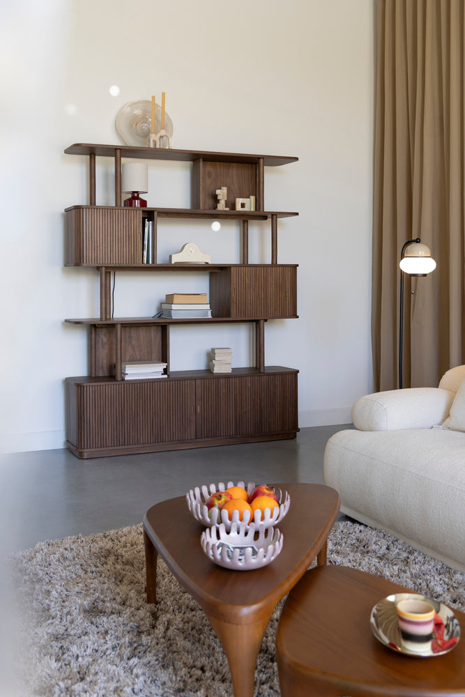 Barbier walnut bookcase styled in a living room