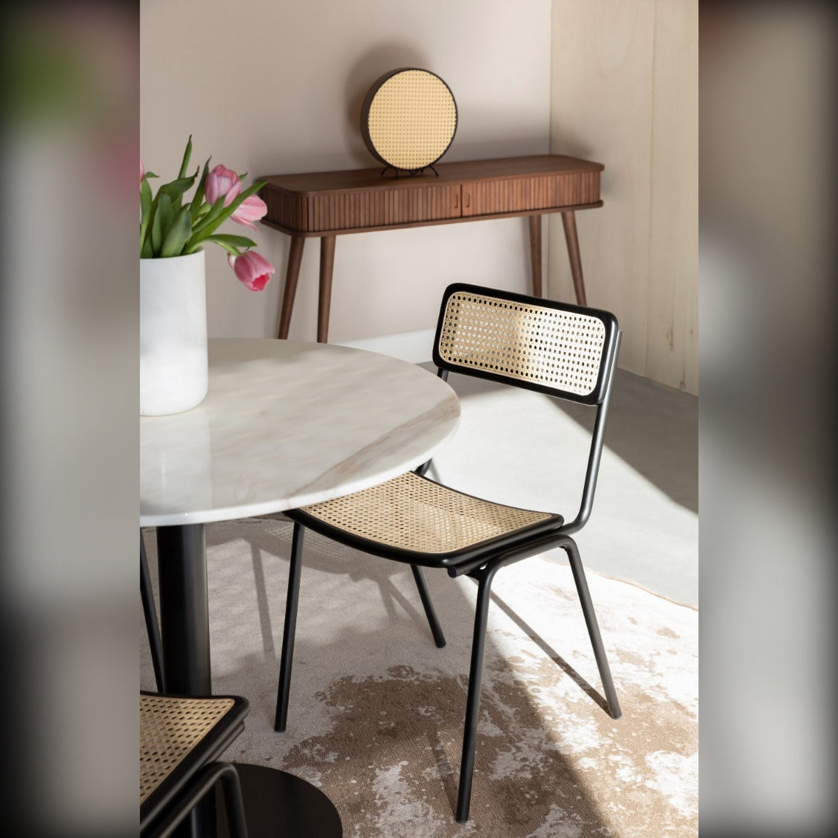 Dining Chair Jort Natural Black Domestica – Lifestyle – At a Round White Table with a Wall Mirror Behind