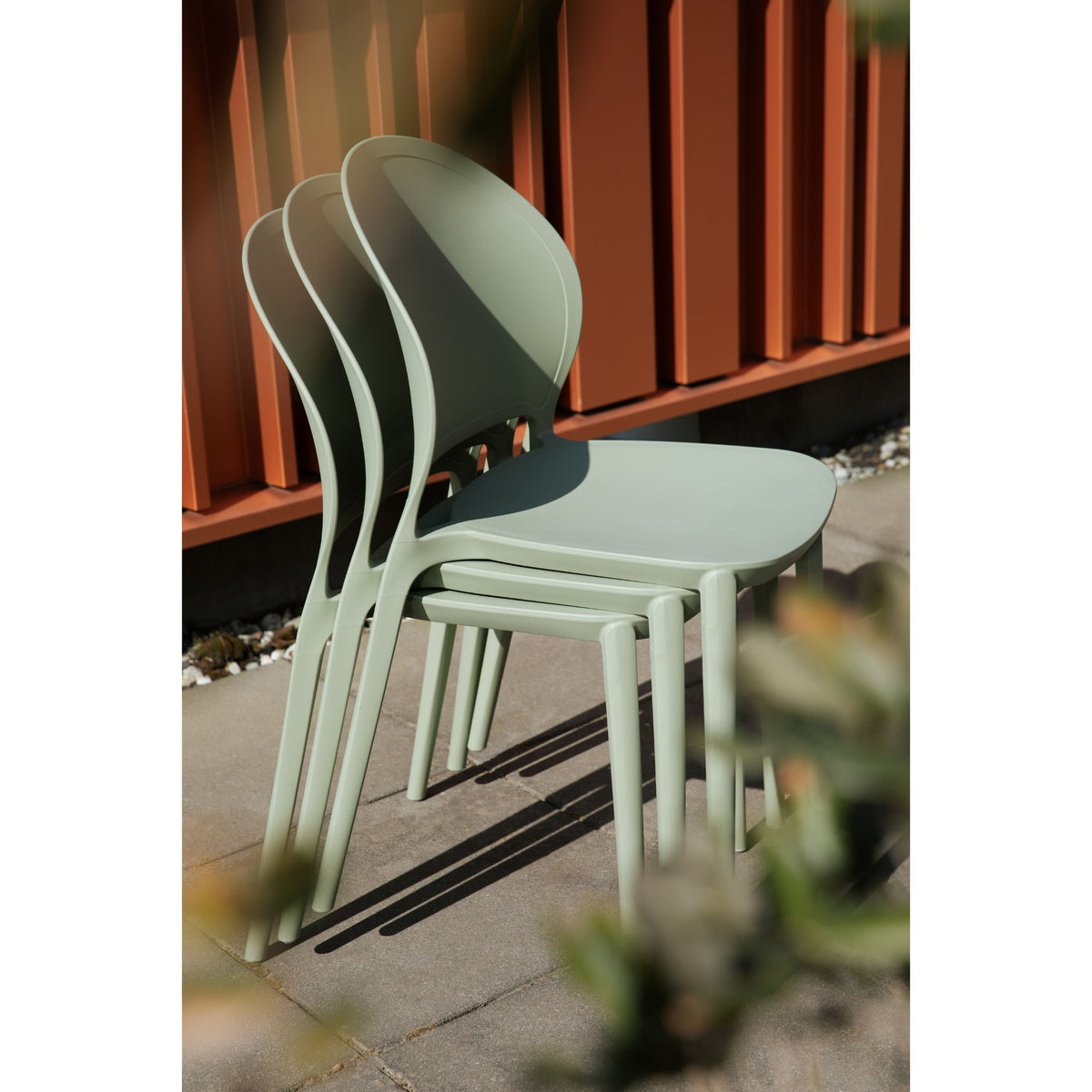 Outdoor Chair Sjoerd Grey Domestica – Lifestyle – Stacked Chairs on a Terrace