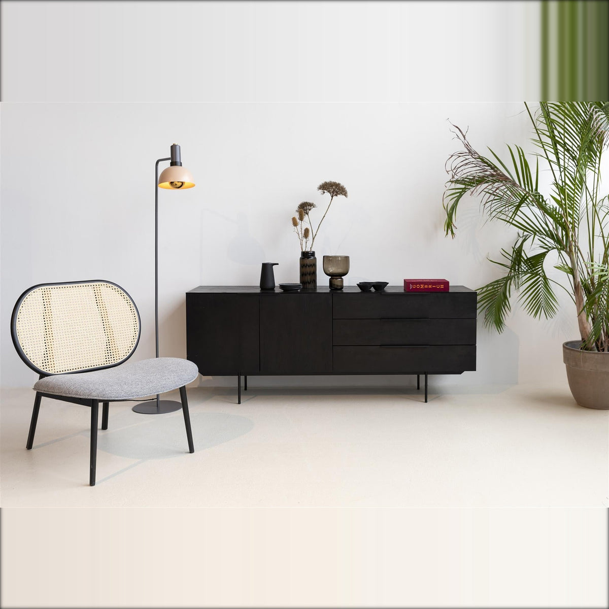 Lounge Chair Spike Natural Grey Domestica – Lifestyle – Living Room with Black Sideboard and Plant