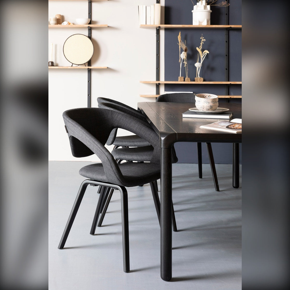 Dining Table Storm 220x90 Black Domestica – Lifestyle – With Black Chairs and Wall Shelving