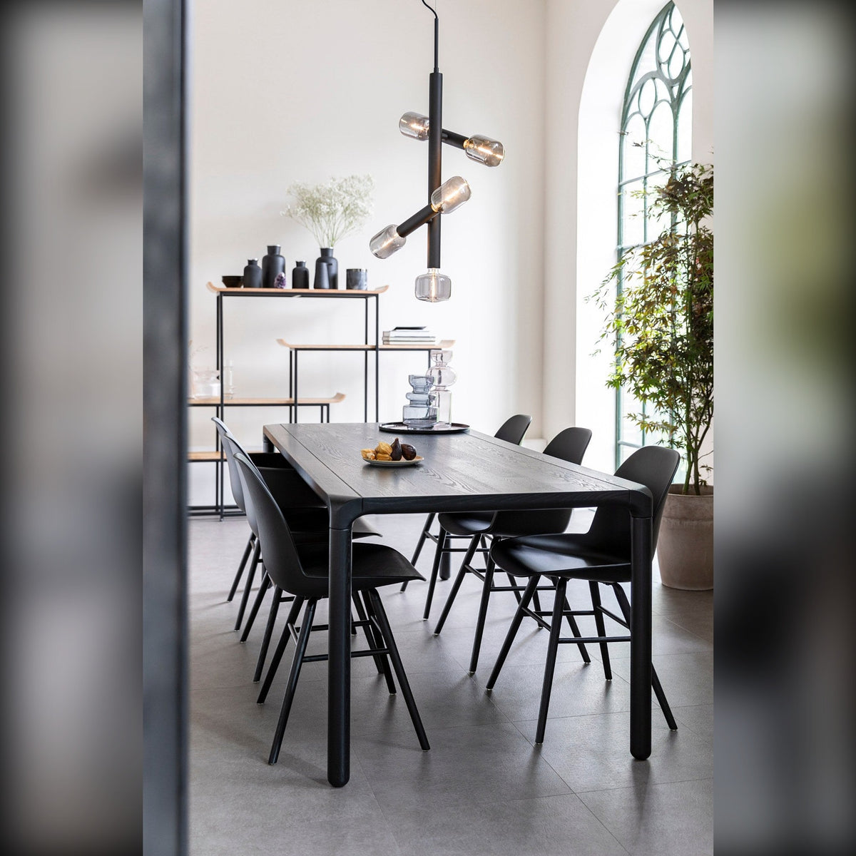 Dining Table Storm 220x90 Black Domestica – Lifestyle – Bright Room with Black Chairs and Pendant Light