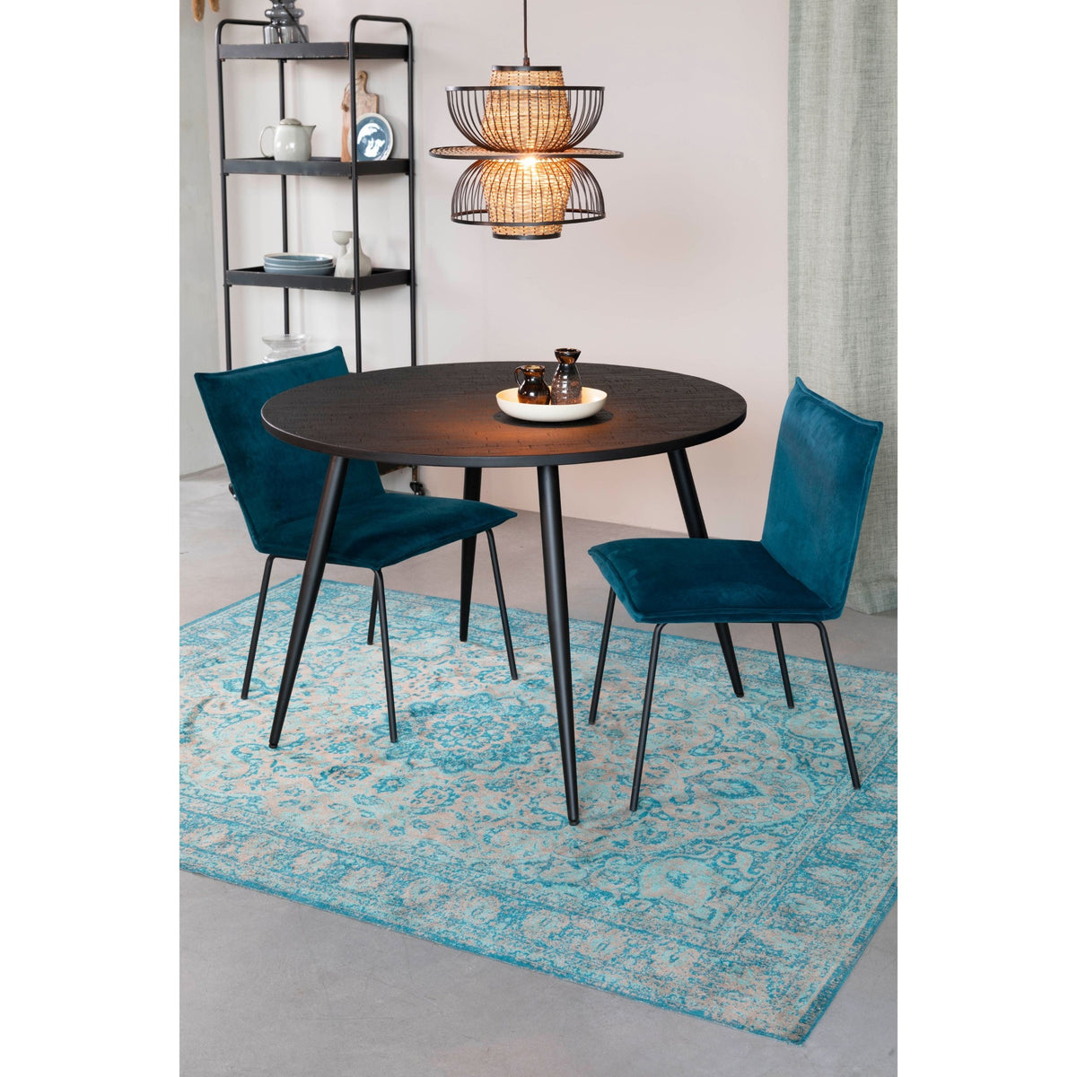 Dining Table Mo 110 Black Domestica – Lifestyle – With Blue Chairs on a Patterned Rug