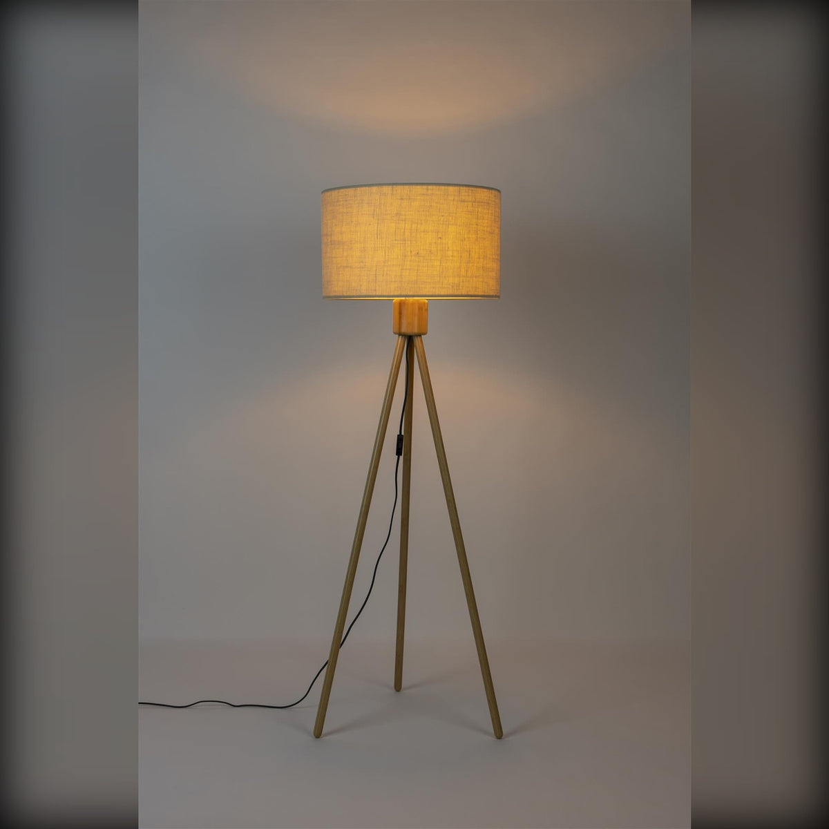 Floor Lamp Fan Bamboo Domestica – Lit, on Grey Background