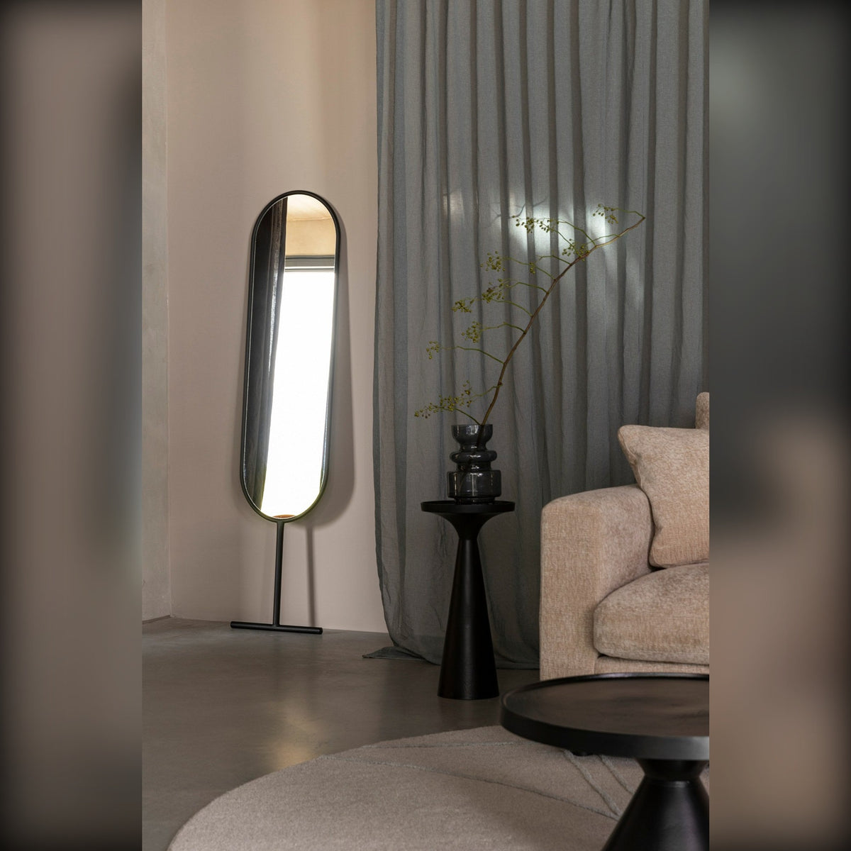 Side Table Floss Black Domestica – Lifestyle – Beside a Sofa with a Standing Mirror