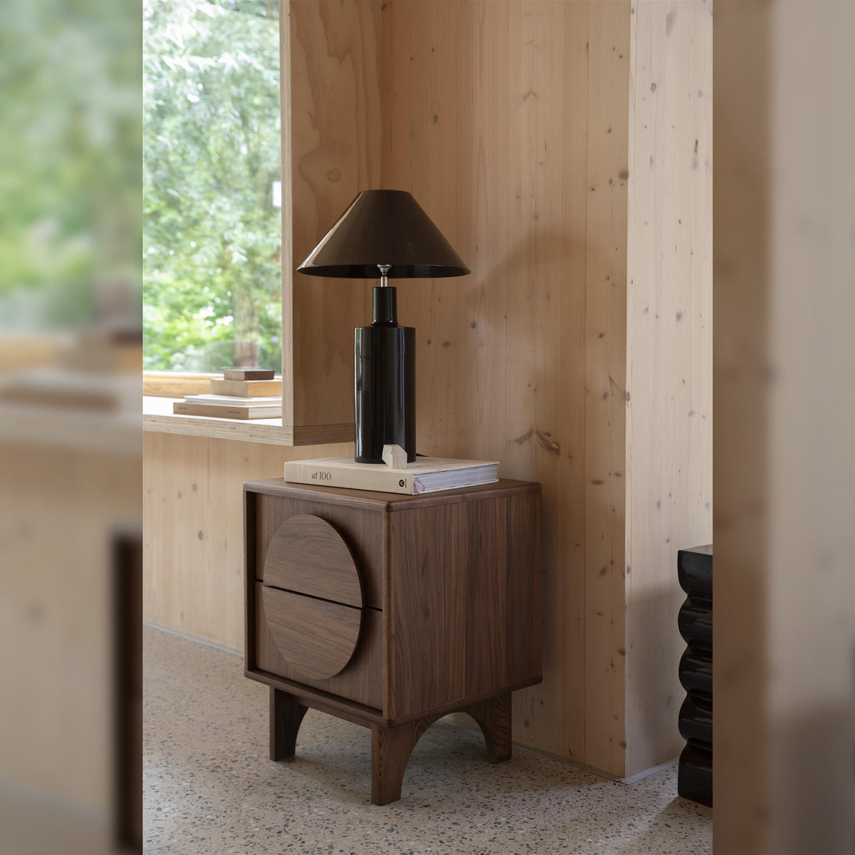 Side Table Groove Walnut Domestica – Lifestyle – Beside a Wooden Wall with Black Table Lamp
