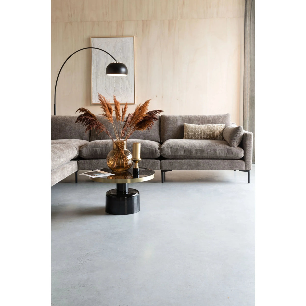 Coffee Table Glam Black Domestica – Lifestyle – In Front of a Grey Sofa with an Arc Lamp