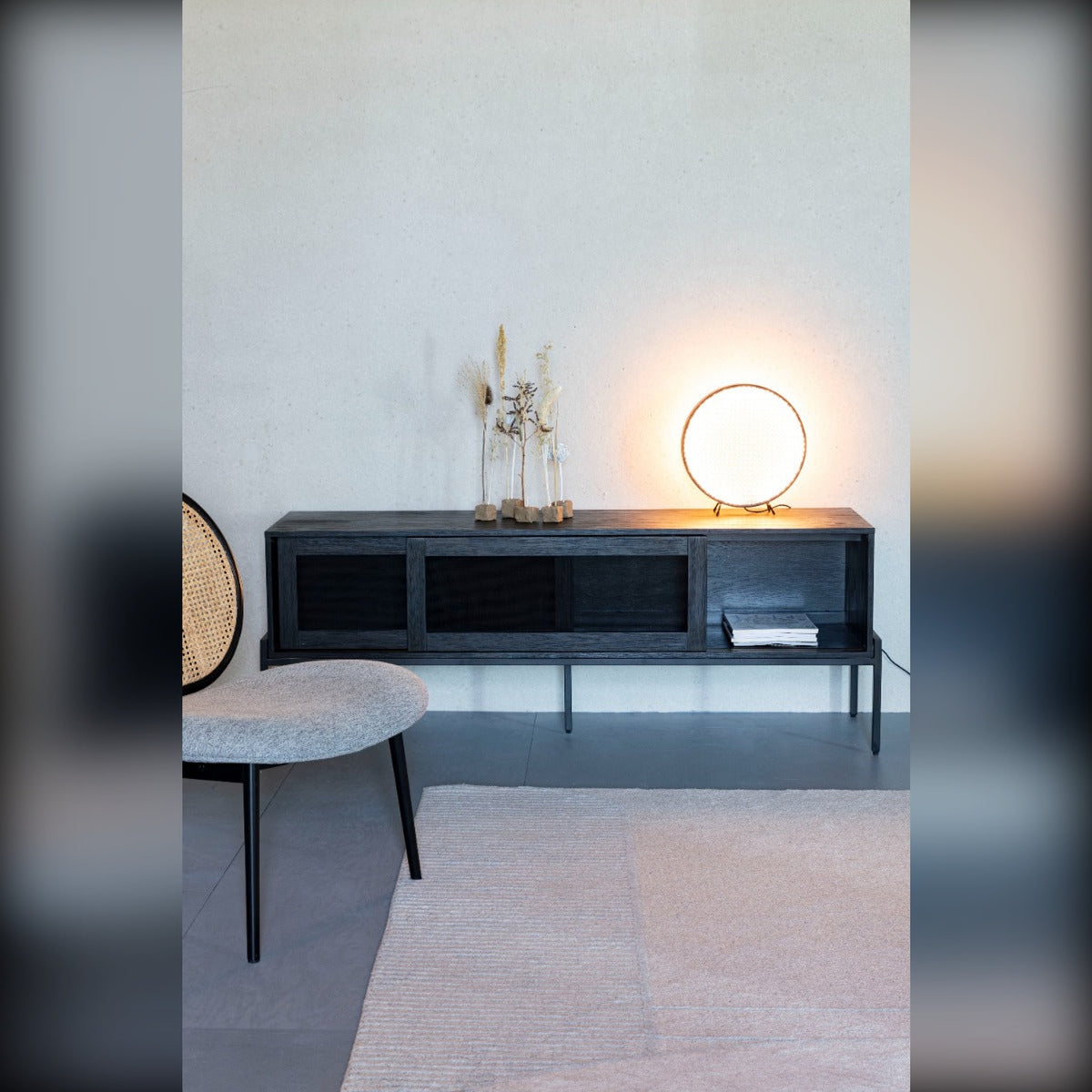Sideboard Hardy Black Oak Domestica – Lifestyle – With a Globe Lamp and Round Table