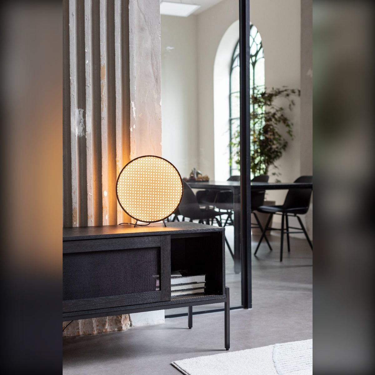 Sideboard Hardy Black Oak Domestica – Lifestyle – With a Globe Lamp Beside a Dining Area