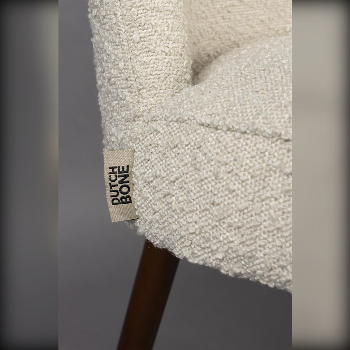 Dining Chair Barbara Boucle Beige Domestica – Side Detail with Dutchbone Label and Walnut Leg