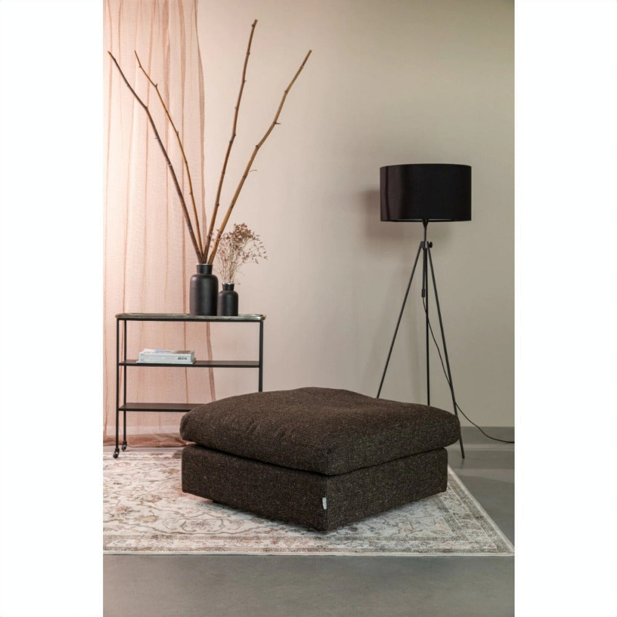 Floor Lamp Lesley Black Domestica – Lifestyle – Beside a Pouf with Dried Branches
