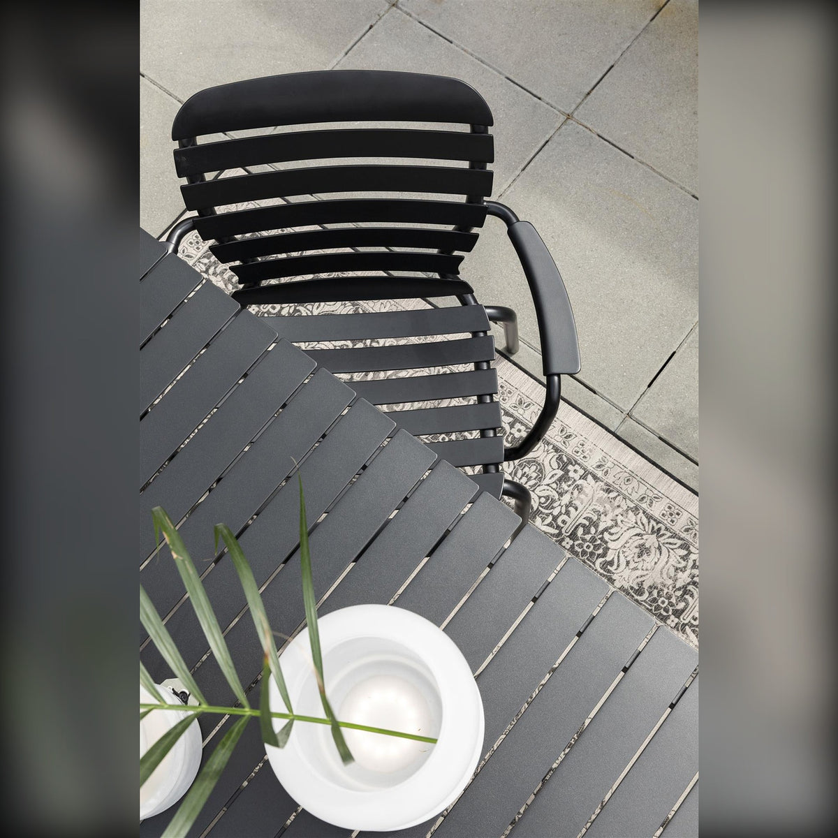 Garden Armchair Vondel Black Domestica – Lifestyle – From Above with a Plate and Herbs