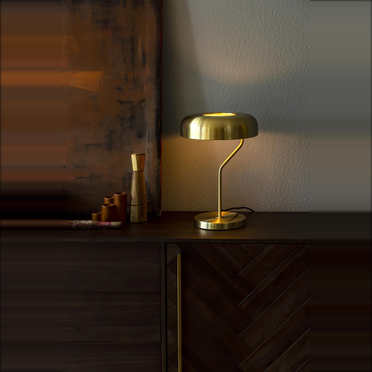 Desk Lamp Eclipse Brass Domestica – Lifestyle – Lit on a Dark Wood Sideboard