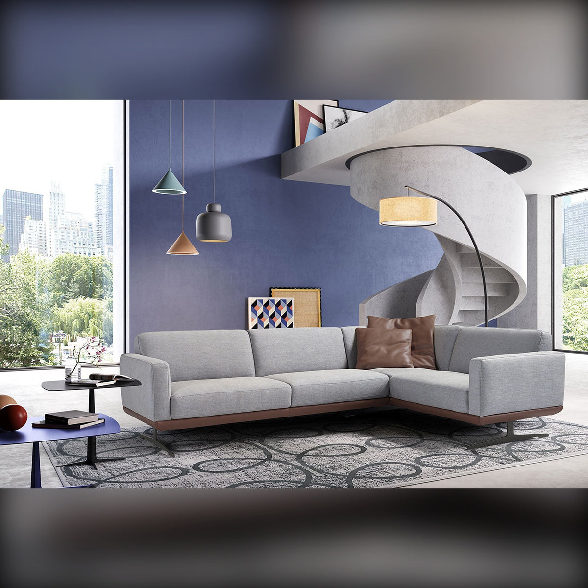 Gloria Slim Domestica – Lifestyle – Grey Corner Sofa in a Living Room with Spiral Staircase