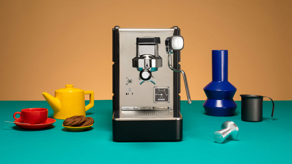 Espresso Machine Stone Plus Domestica – Lifestyle – On a Teal Counter with Colourful Accessories