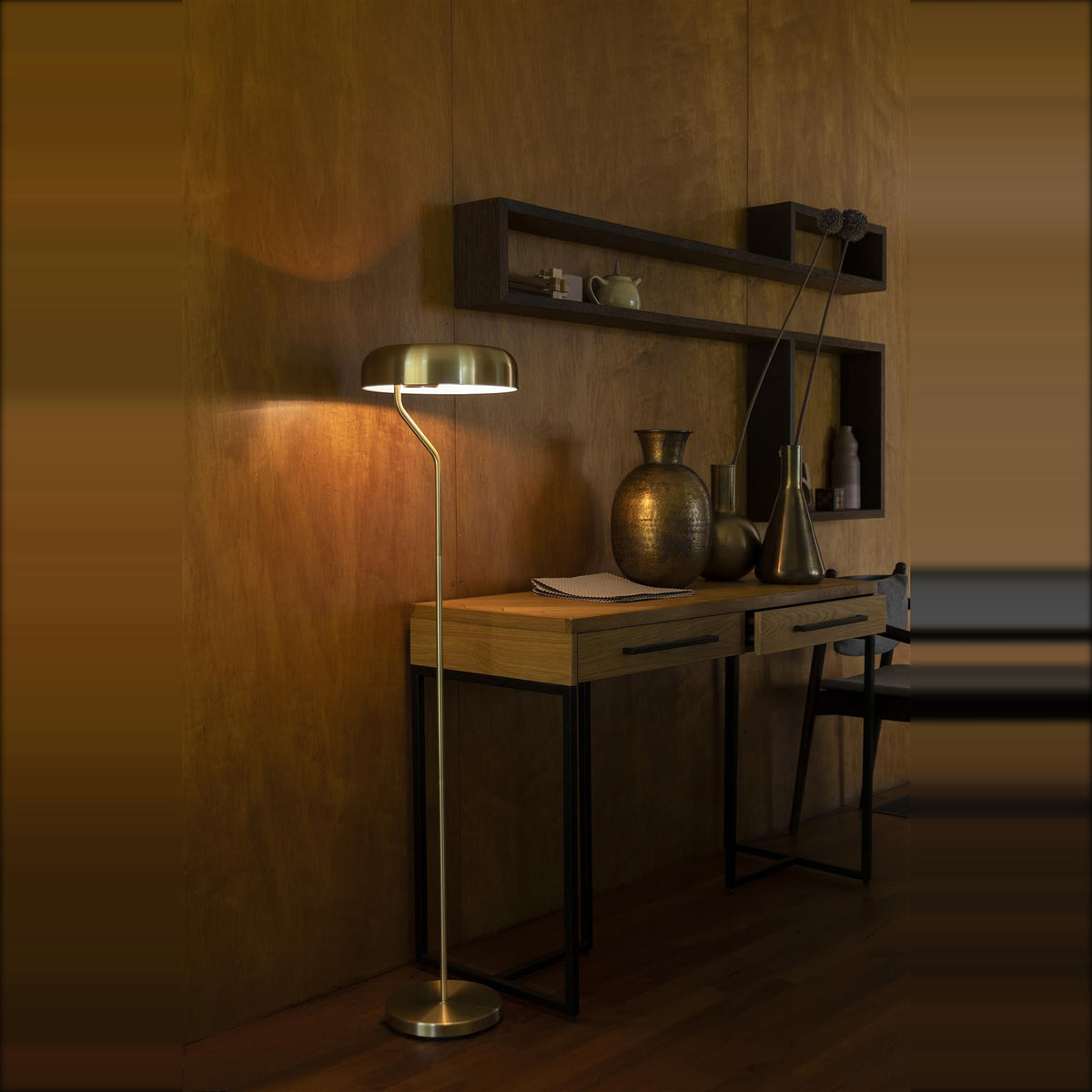 Floor Lamp Eclipse Brass Domestica – Lifestyle – Lit Beside a Desk, Wood-Panelled Wall