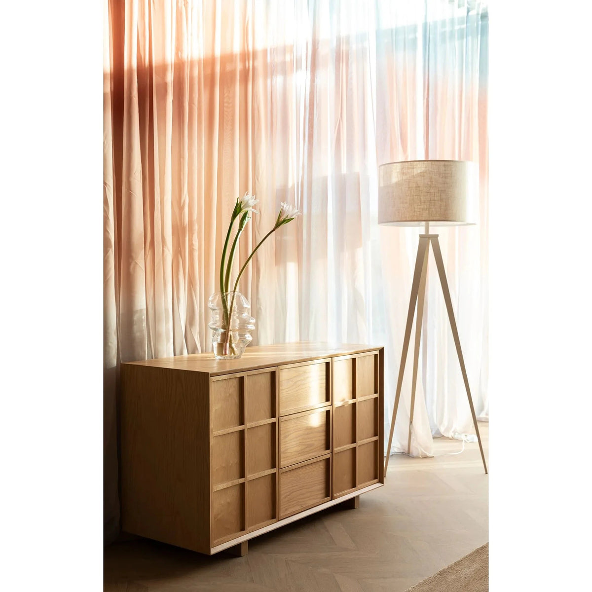 Sideboard Raster High Domestica – Lifestyle – With Vase and Floor Lamp by Sheer Curtains