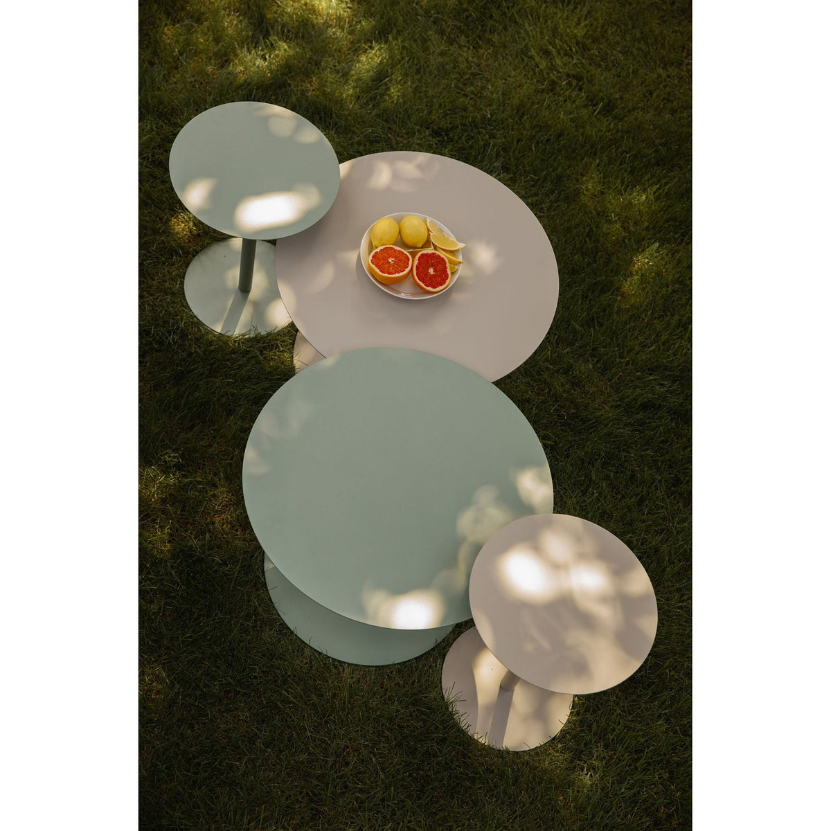 Side Table Snow Desert Sage Domestica – Lifestyle – Group of Tables from Above on Grass