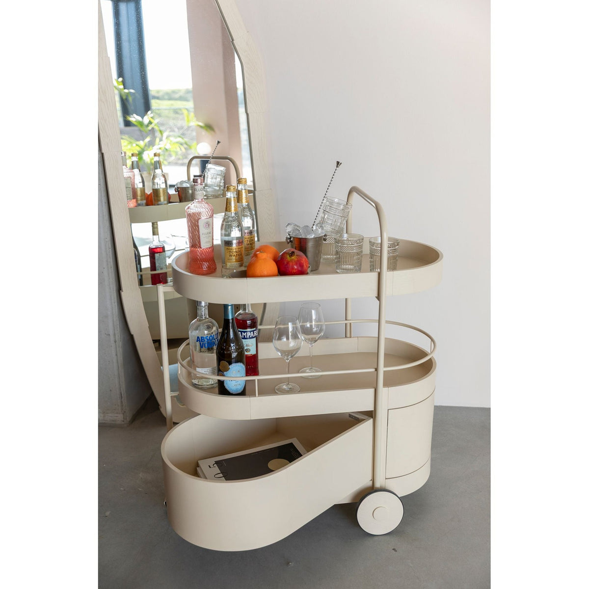 Trolley Wim Beige Domestica – Lifestyle – Styled as a Bar Cart with Bottles and Fruit