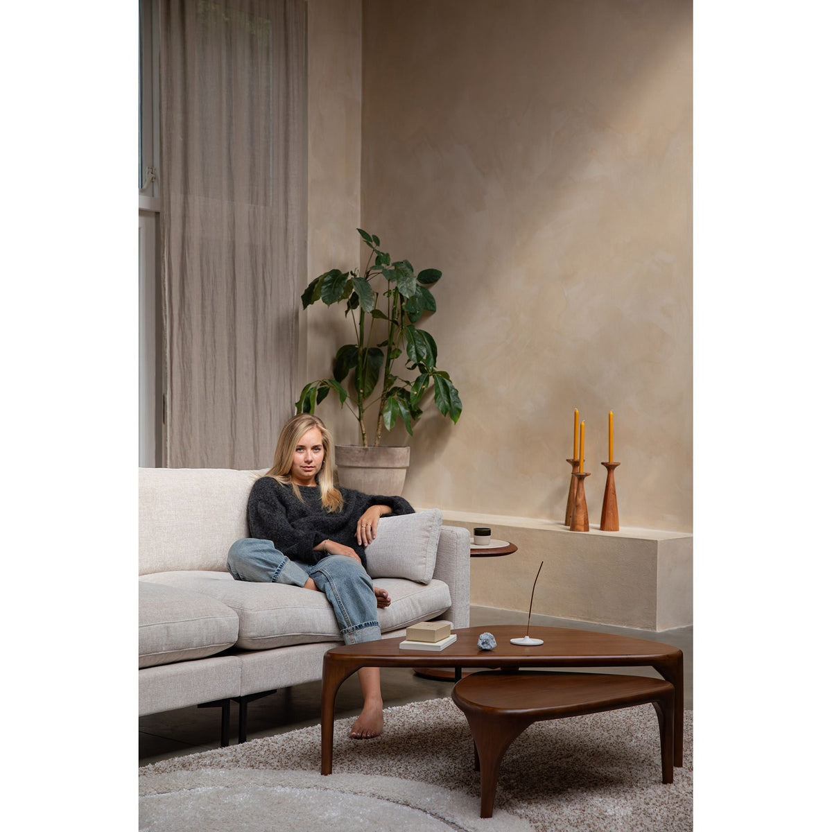 Sofa Summer 3-Seater Cream Domestica – Lifestyle – Person Seated Beside a Wooden Coffee Table