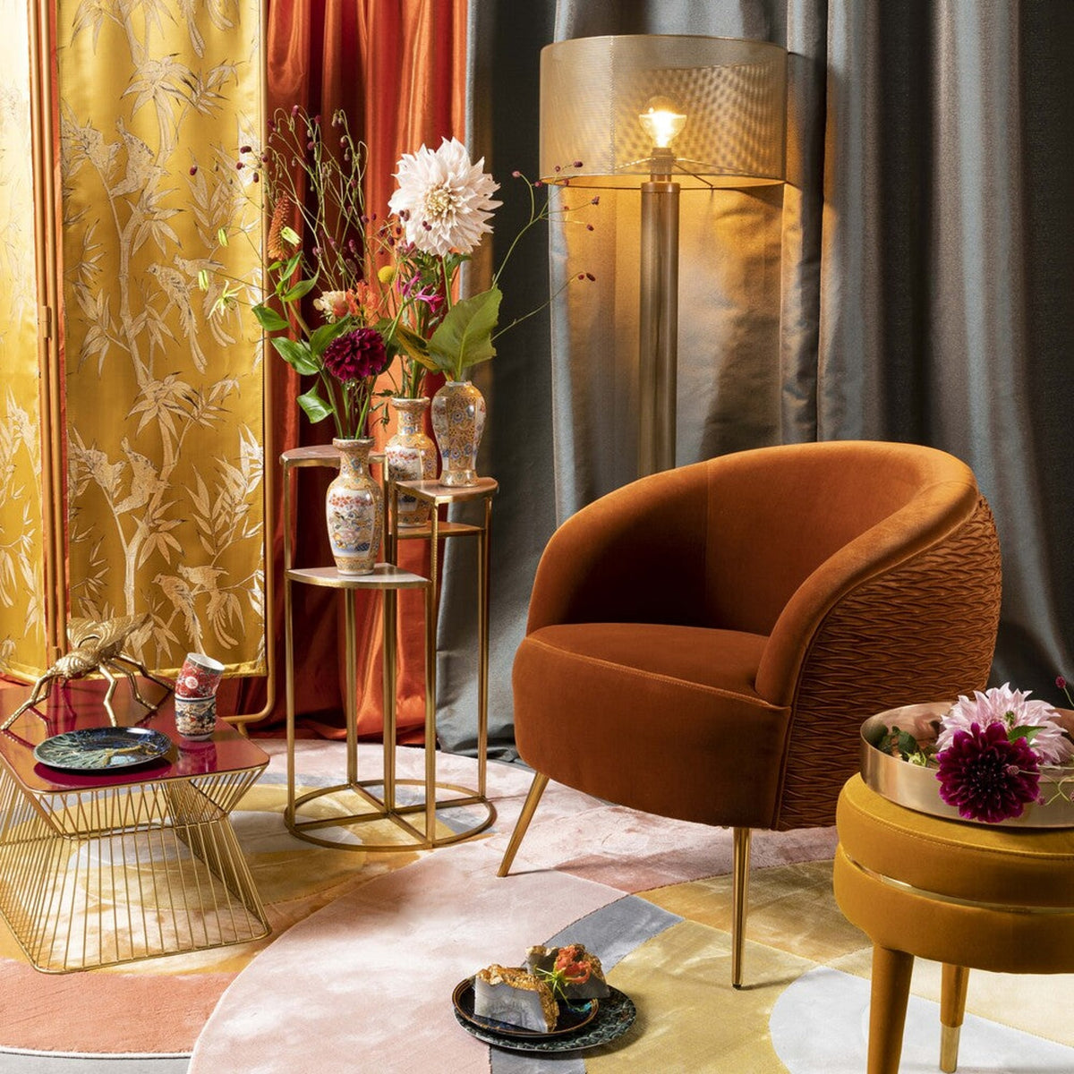 Lounge Chair So Curvy Orange Domestica – Lifestyle – With Gold Side Tables and Drapes