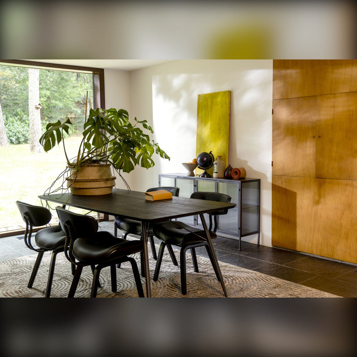 Dining Chair Blackwood Black Domestica – Lifestyle – Around a Black Dining Table with Plants