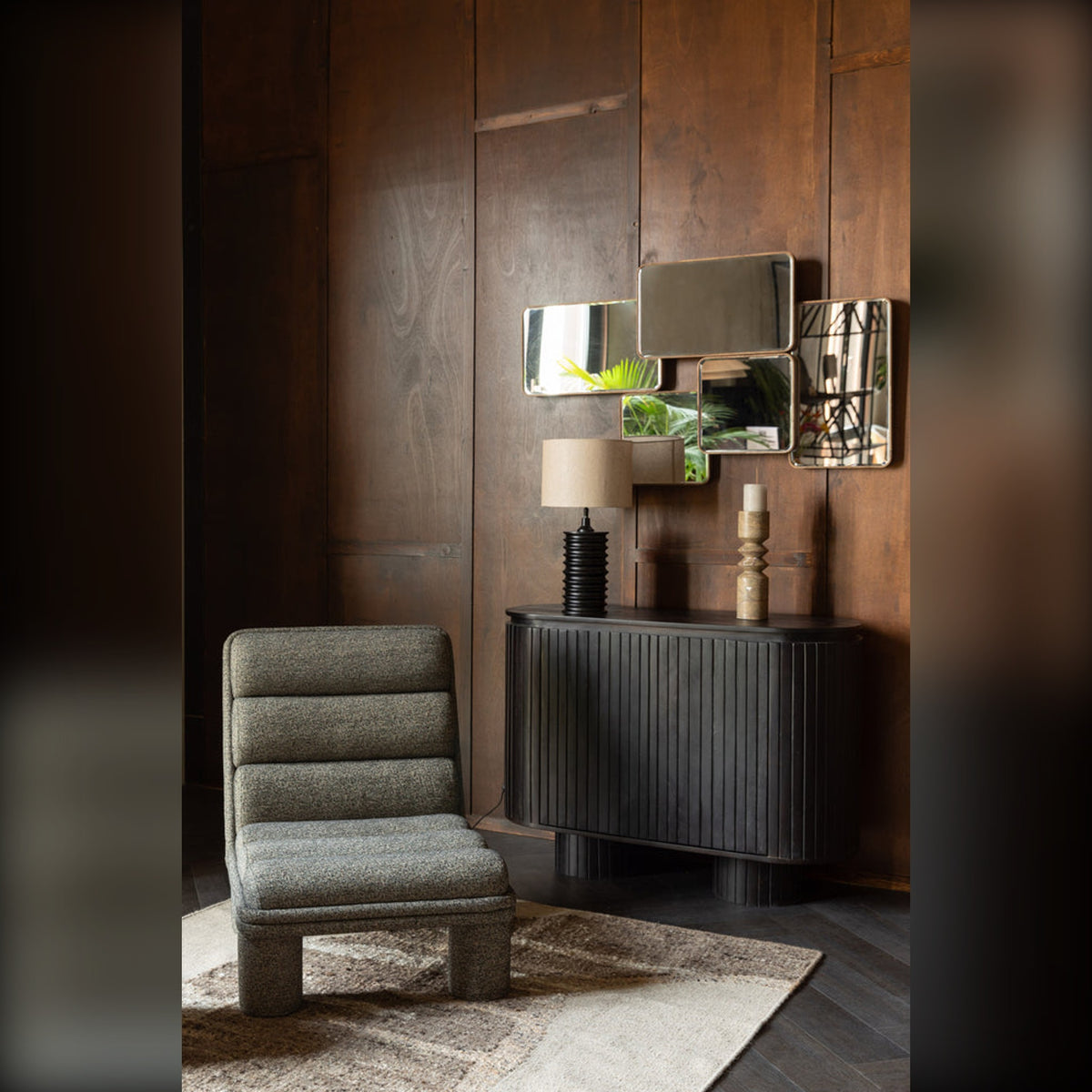 Mirror Cordelia Domestica – Lifestyle – Above a Black Sideboard with a Lounge Chair