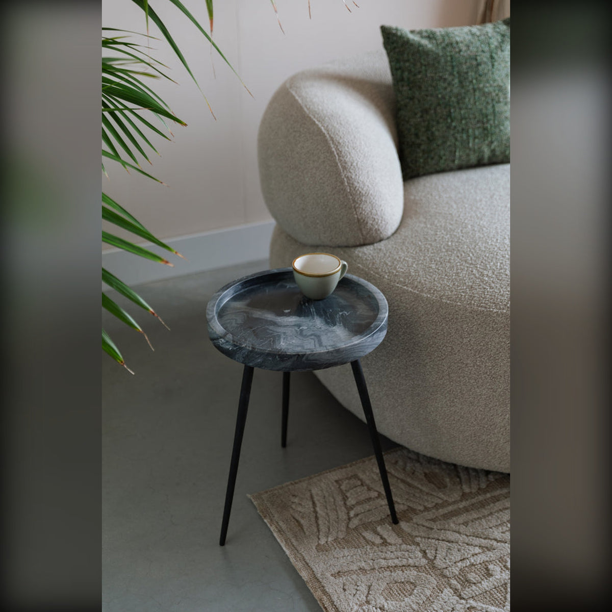 Side Table Karrara Grey Domestica – Lifestyle – Beside a Curved Sofa with Plants