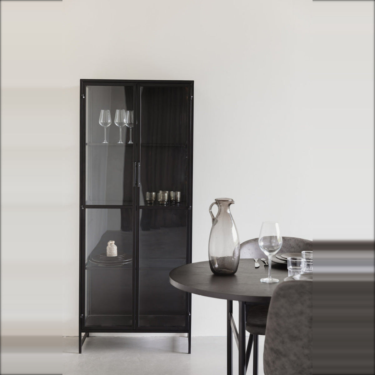 Cabinet Rob Large Black Domestica – Lifestyle – With Glassware Beside a Round Dining Table