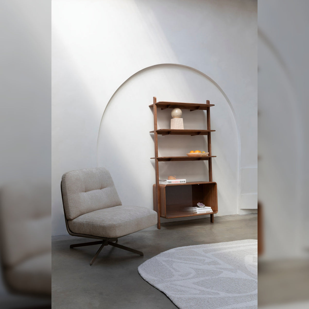 Shelf Rise Walnut Domestica – Lifestyle – Beside a Lounge Chair in an Arched Alcove