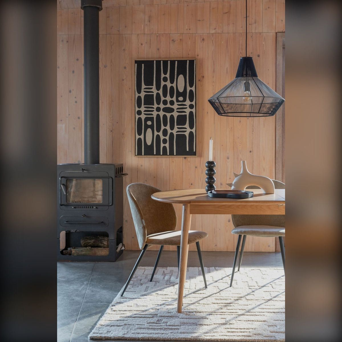 Dining Table Twist Oval Oak Domestica – Lifestyle – With Wood Stove and Pendant Lamp