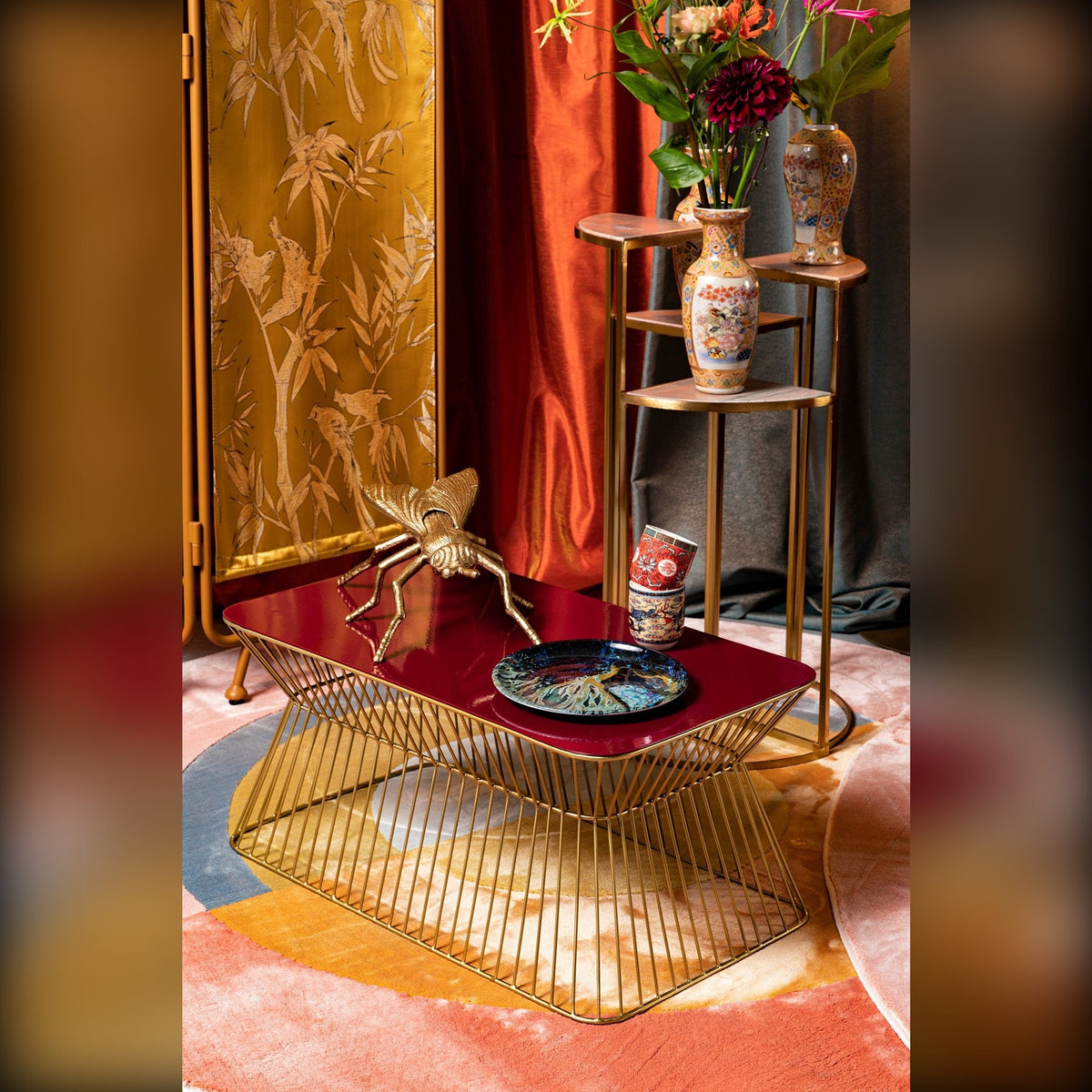 Coffee Table No Offence Wine Red Domestica – Lifestyle – Styled with Accessories and a Gold Shelf