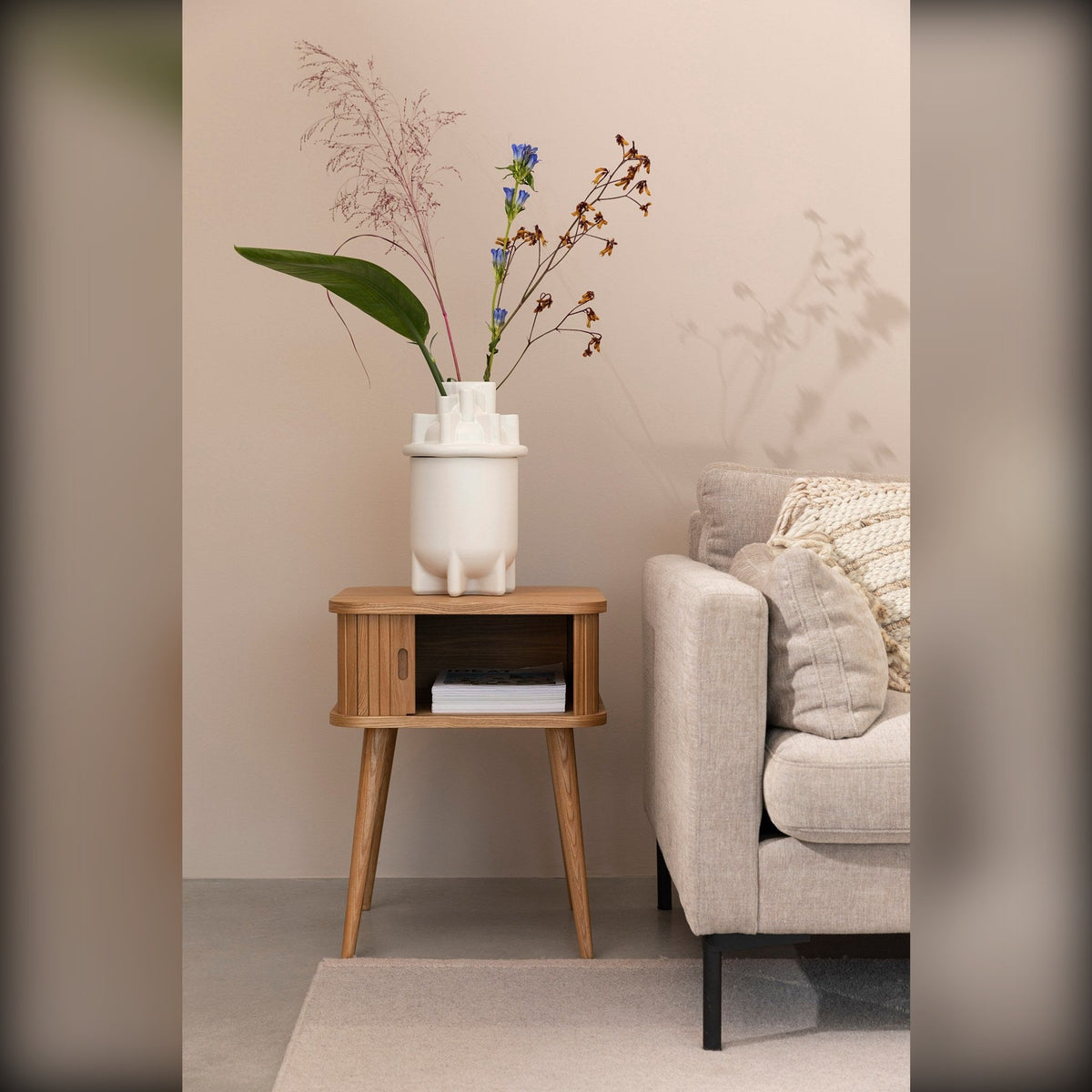 Side Table Barbier Natural Domestica – Lifestyle – Beside a Sofa, Portrait View